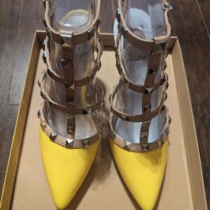 Yellow heeled sandals with studded straps